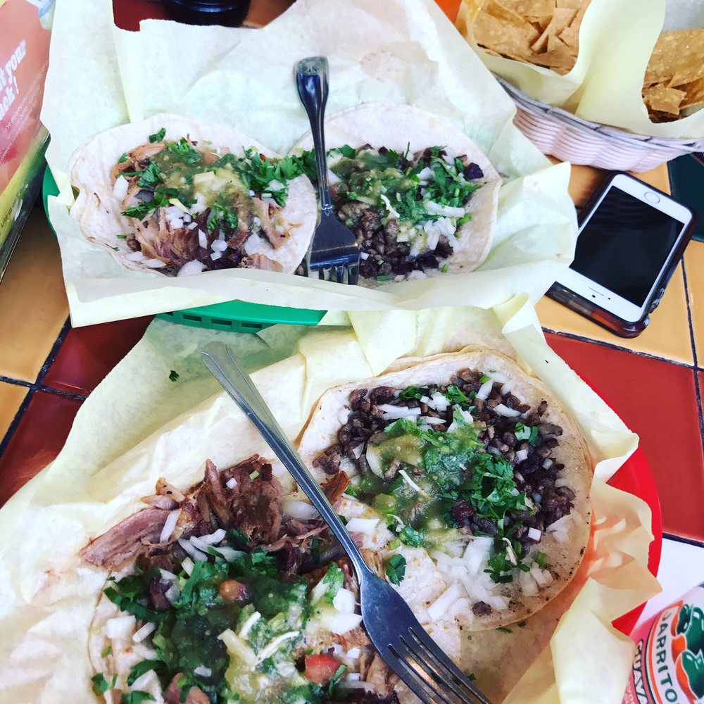 two burritos on a table