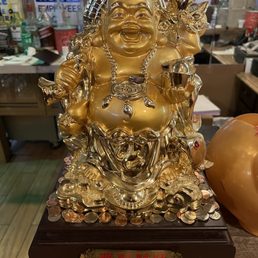 a statue of a laughing buddha a statue of a laughing buddha