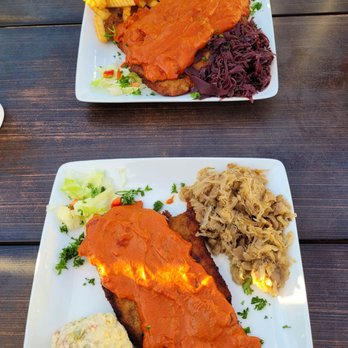 German Guys - Chicken Gypsy Schnitzel with warm Sauerkraut with Mushrooms, German potato salad. XXL Pork Schnitzel Plate with Red Cabbage, Fries. - German Near Me - Stockton, California German Guys - Chicken Gypsy Schnitzel with warm Sauerkraut with Mushrooms, German potato salad. XXL Pork Schnitzel Plate with Red Cabbage, Fries. - German Near Me - Stockton, California