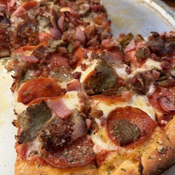 Dominik’s Pizza and grill - 12" Meat Fest Pizza. Thin crust with garlic butter on it. - Pop-Up Restaurants Near Me - Bushnell, Florida Dominik’s Pizza and grill - 12" Meat Fest Pizza. Thin crust with garlic butter on it. - Pop-Up Restaurants Near Me - Bushnell, Florida