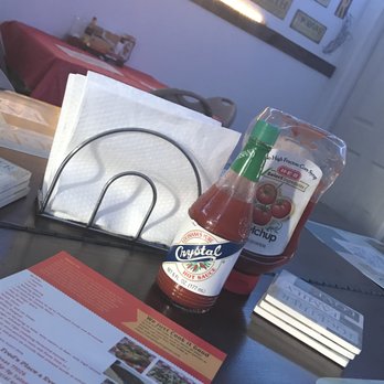 Fred's Place 4 Events - a bottle of ketchup and a menu on a table - Caterers Near Me - Houston, Texas