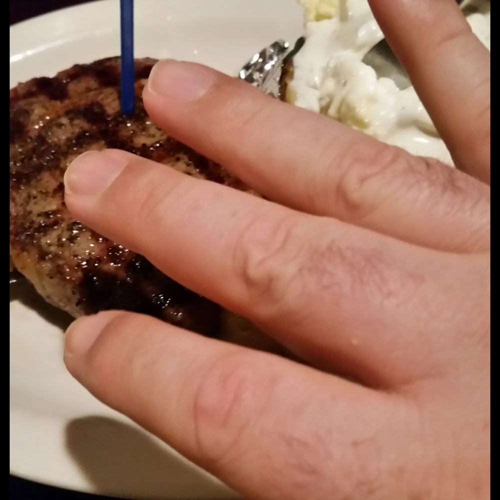 Rick's Crossroads Grille - My hand in front of the steak - Steakhouses Near Me - Lincoln, Alabama Rick's Crossroads Grille - My hand in front of the steak - Steakhouses Near Me - Lincoln, Alabama