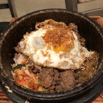 Burning Rice - My friends bowl with an egg on top - Korean Near Me - Hurst, Texas
