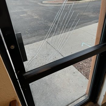 Coyote South Santa Fe - Shattered glass on back entrance - Hotels Near Me - Santa Fe, New Mexico