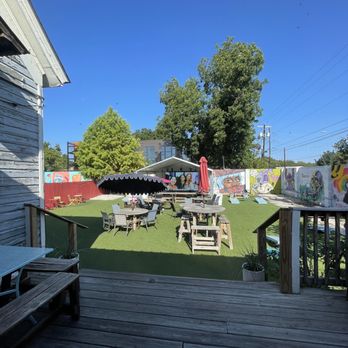 Praxis Coffee Roasters - Outdoor seating, pet friendly, two sets of cornhole, large shaded screen. Tons of parking available - Coffee Roasteries Near Me - Austin, Texas