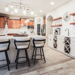 Jostar Interiors - Large kitchen with beverage buffet and double islands