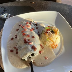 La Mexicana - Chile relleno.  Specialty of this restaurant. It Comes with rice, almonds, raisins and creamy sweet almond cinnamon sauce.