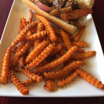 Las Brasas - Limo saltado sandwich and sweet potato fries - Latin American Near Me - Decatur, Georgia Las Brasas - Limo saltado sandwich and sweet potato fries - Latin American Near Me - Decatur, Georgia
