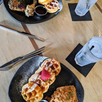 Taste Bar + Kitchen - Jerk chicken and waffles (top) and cajun chicken and waffles (bottom) - Cocktail Bars Near Me - Houston, Texas Taste Bar + Kitchen - Jerk chicken and waffles (top) and cajun chicken and waffles (bottom) - Cocktail Bars Near Me - Houston, Texas