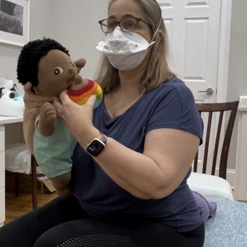 Atlanta Lactation - Katherine demonstrating nipple positioning to achieve a proper latch. - Lactation Services Near Me - Atlanta, Georgia Atlanta Lactation - Katherine demonstrating nipple positioning to achieve a proper latch. - Lactation Services Near Me - Atlanta, Georgia