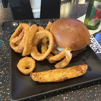 Wolfey's Bistro & Pub - Mushroom Swiss Burger w/ some onion rangs - New American Near Me - Elyria, Ohio