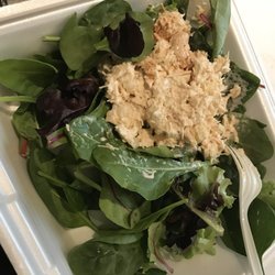I ate part of it before I took photo.. but I got a pineapple cashew chicken salad scoop  on a bed of greens! It is so good.