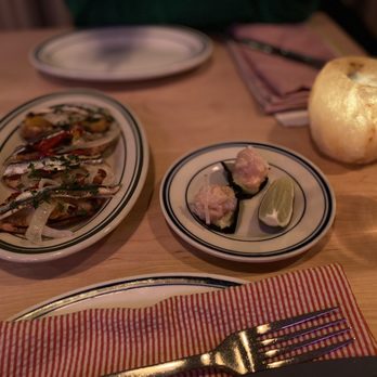 Mfk - two plates of food on a table - Seafood Near Me - Chicago, Illinois Mfk - two plates of food on a table - Seafood Near Me - Chicago, Illinois