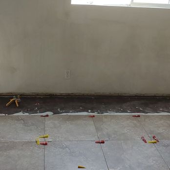 Sean’s Flooring & Painting Services - Before the paint job in one of the bedrooms - Flooring Near Me