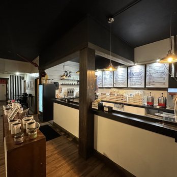 Sweet Peaks - a woman in a white apron preparing food in a restaurant - Ice Cream & Frozen Yogurt Near Me - Whitefish, Montana