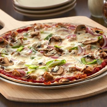 Carbone's Pizzeria - Forest Lake - a pizza on a wooden board - Pizza Near Me - Forest Lake, Minnesota Carbone's Pizzeria - Forest Lake - a pizza on a wooden board - Pizza Near Me - Forest Lake, Minnesota