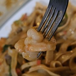 Wasabi's - A fork with a shrimp from the main entrée.