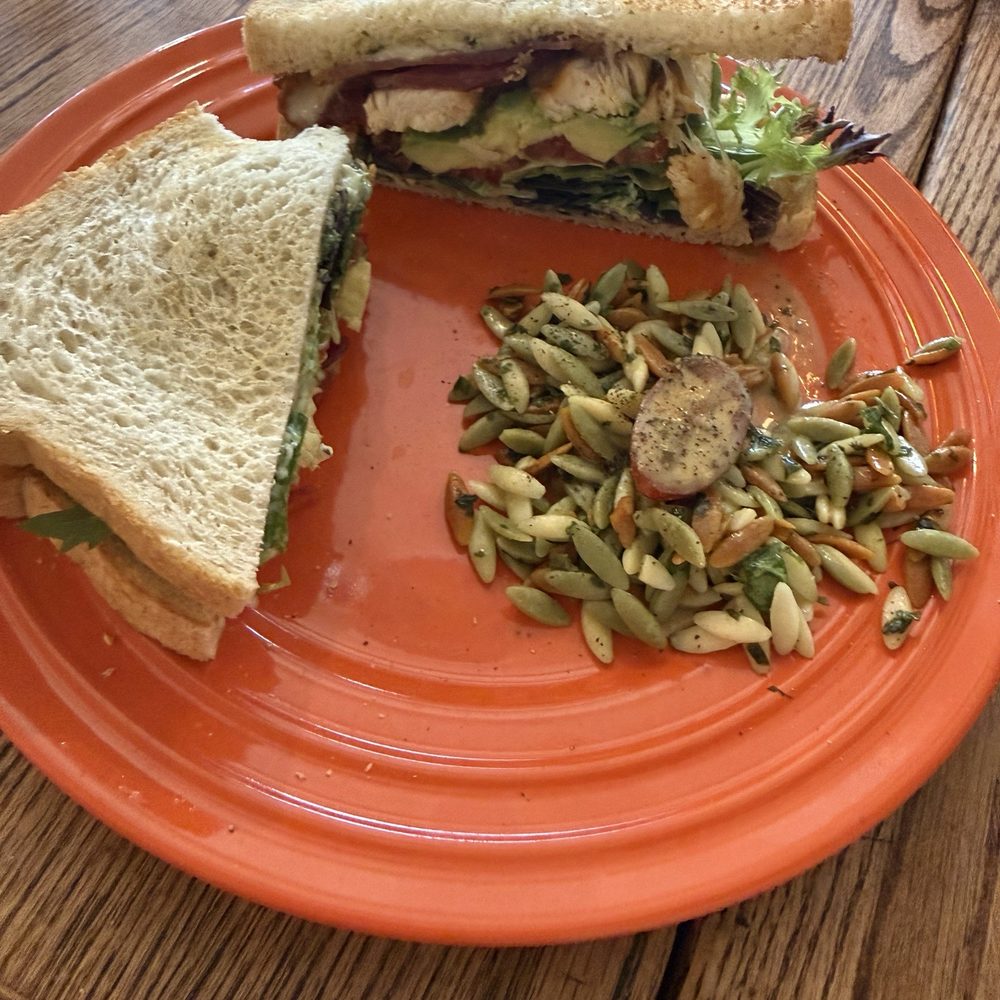 Avocado, bacon, and turkey sandwich on sourdough with an orzo salad. Avocado, bacon, and turkey sandwich on sourdough with an orzo salad.