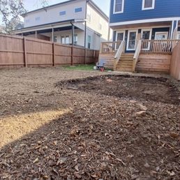 Regraded yard and dugout area for putting green