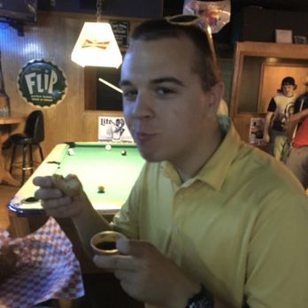 Beer Thirty - a man sitting at a pool table - Dive Bars Near Me - De Soto, Kansas