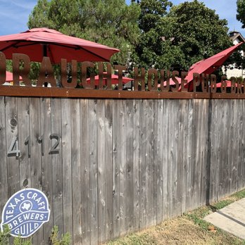 Draught House Pub & Brewery - a wooden fence and umbrellas - Brewpubs Near Me - Austin, Texas Draught House Pub & Brewery - a wooden fence and umbrellas - Brewpubs Near Me - Austin, Texas