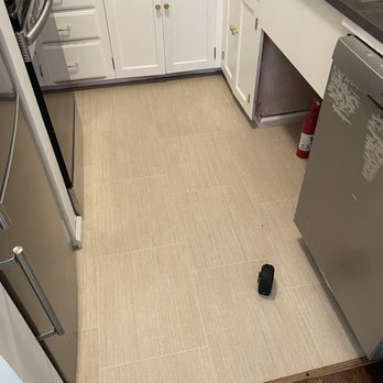 Vogel's Carpet & Flooring - a kitchen with white cabinets and a stainless steel dishwasher - Carpeting Near Me - Seattle, Washington