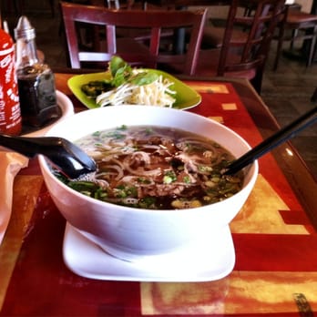 Pho Nom Nom - Large pho chin (well-done beef) with their super cool hanging soup spoon! - Vietnamese Near Me - Rockville, Maryland Pho Nom Nom - Large pho chin (well-done beef) with their super cool hanging soup spoon! - Vietnamese Near Me - Rockville, Maryland