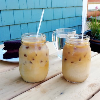 Arbutus Coffee - Two cold brew coffees with cream and the flourless chocolate cake (or vegan chocolate cake?) - Coffee & Tea Near Me - Vancouver, British Columbia