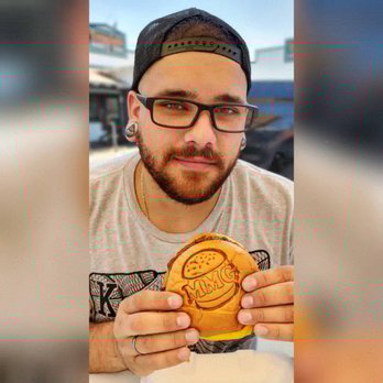 Mad Madeline's Grill - Babe with his burger - Burgers Near Me - Temecula, California