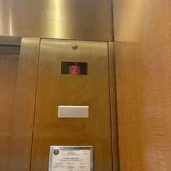 Dillard's - Tall Gold Kone Series 220 elevator, Dillard's The Shoppes at East Chase