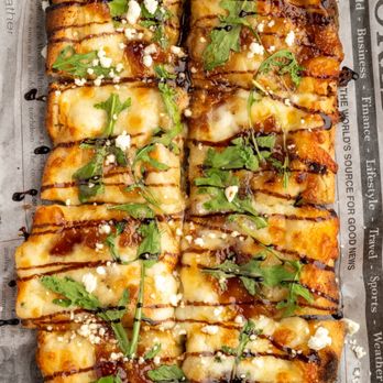 Blessing’s Family Restaurant - Fig and goat cheese pinsa flatbread. - American Near Me - Colonie, New York Blessing’s Family Restaurant - Fig and goat cheese pinsa flatbread. - American Near Me - Colonie, New York