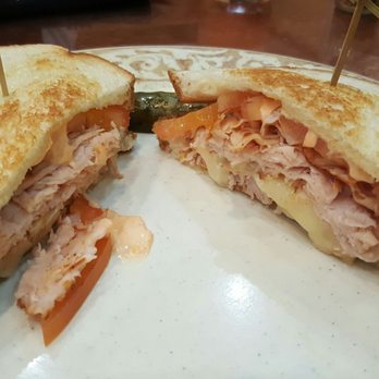 Another Broken Egg Cafe - This is the turkey, tomato & Brie sandwich & it comes with either a side of fruit, grits or bacon I believe. I had the fruit, pretty good. - Breakfast & Brunch Near Me - Houston, Texas