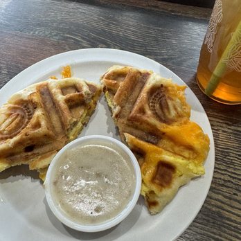Just Love Coffee Cafe- Shelby Township - Sausage Egg and Cheese Biscuit with side of sausage gravy - Breakfast & Brunch Near Me - Shelby Township, Michigan
