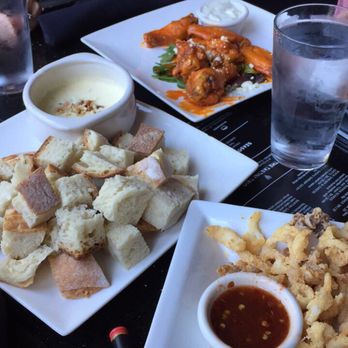 Bartini - Happy hour fondue, calamari, and wings. Everything was delicious! - Lounges Near Me - Portland, Oregon