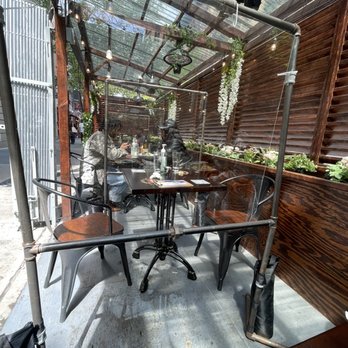 5ive Spice - Mikey chen in the corner of their outdoor patio - Vietnamese Near Me - New York, New York
