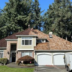 Rainier Roof Restoration - Middle of applying treatment