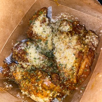 J's Creole Wings - Garlic Parmesan w/lemon pepper sprinkled on it jumbled on top of the fries in a to go fries box - Chicken Wings Near Me - New Orleans, Louisiana