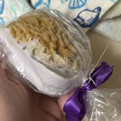 Olive Morada - Close up of soap with sponge