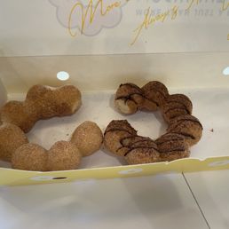 Box with some leftover churro and chocolate churro segments Box with some leftover churro and chocolate churro segments