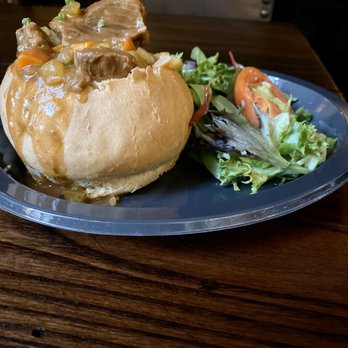 Leaky Cauldron™ - Beef, Lamb and Guinness Stew w/ salad - British Near Me - Orlando, Florida Leaky Cauldron™ - Beef, Lamb and Guinness Stew w/ salad - British Near Me - Orlando, Florida