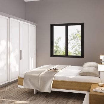 ADU Concepts - a bedroom with a bed and a desk - General Contractors Near Me - Reseda, California
