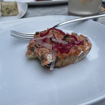 Tagliata - Smoked salmon appetizer, topped with pickled onion and radish shavings. - Italian Near Me - Baltimore, Maryland Tagliata - Smoked salmon appetizer, topped with pickled onion and radish shavings. - Italian Near Me - Baltimore, Maryland