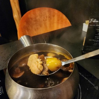 Simply Dipped Fondue - an egg being cooked in a pot - Fondue Near Me - Fredericksburg, Texas