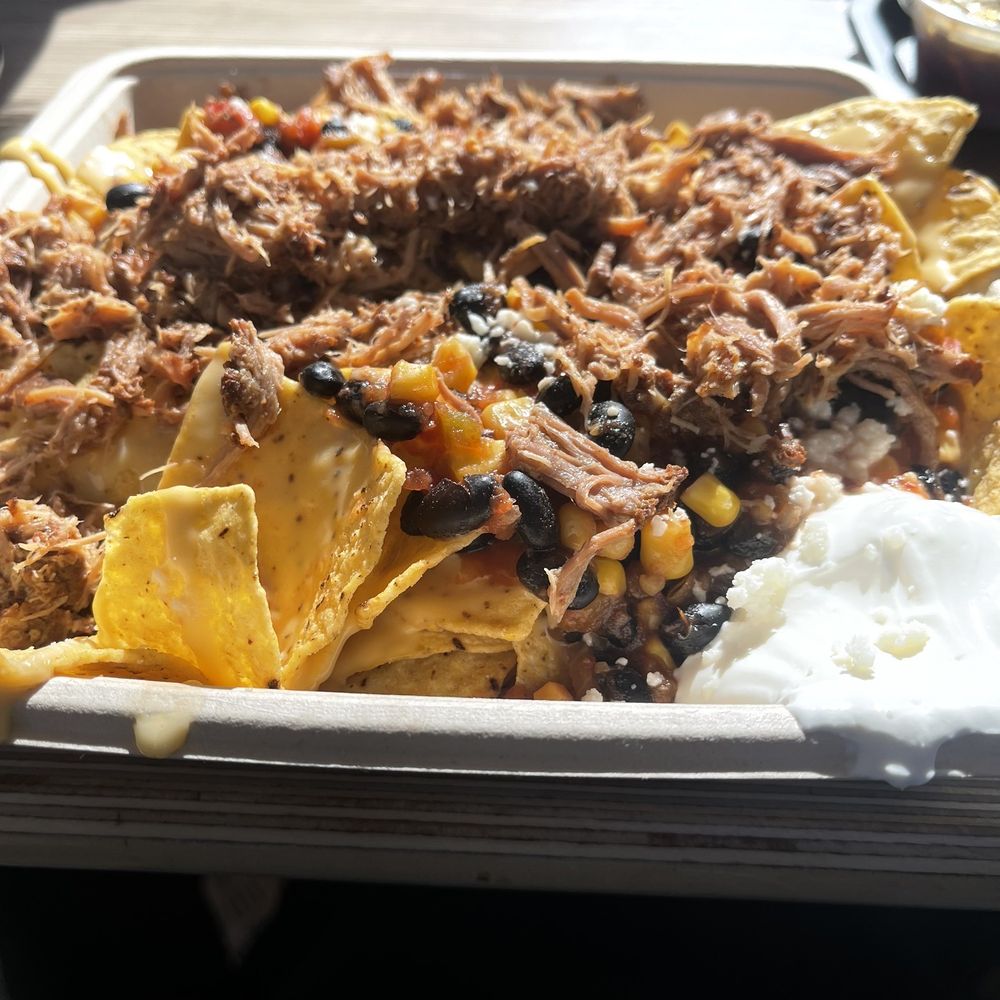 Loaded nachos with pork. Very good. Ton of food! Loaded nachos with pork. Very good. Ton of food!
