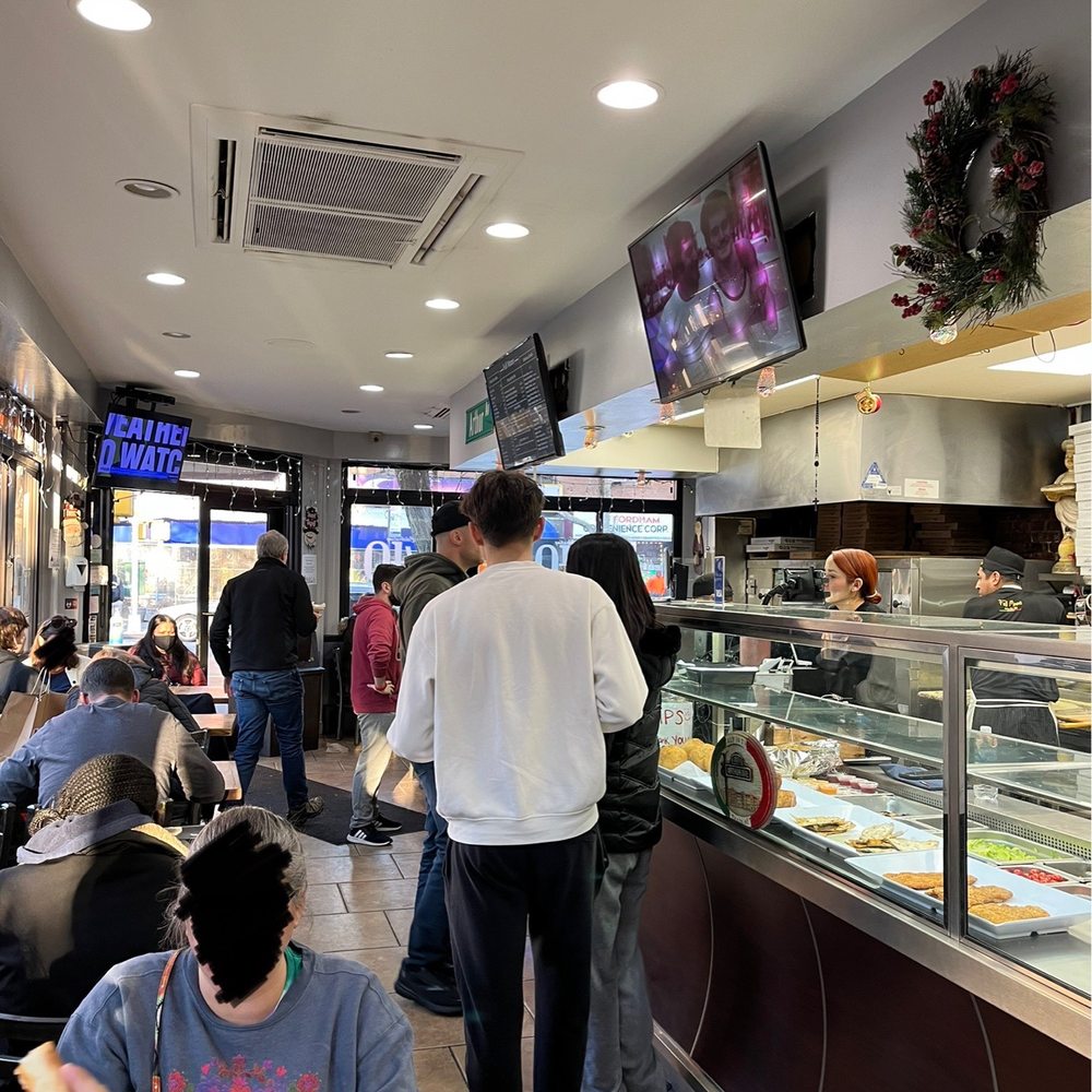 Mezza Luna Pizza - people eating pizza - Pizza Near Me - Bronx, New York Mezza Luna Pizza - people eating pizza - Pizza Near Me - Bronx, New York