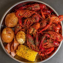 Crawfish boil served with corn potatoes eggs and sausages