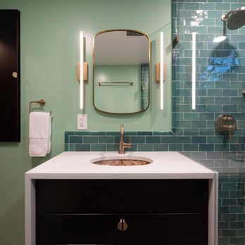 Creative Kitchens & Baths Seattle - a bathroom with green tile - General Contractors Near Me