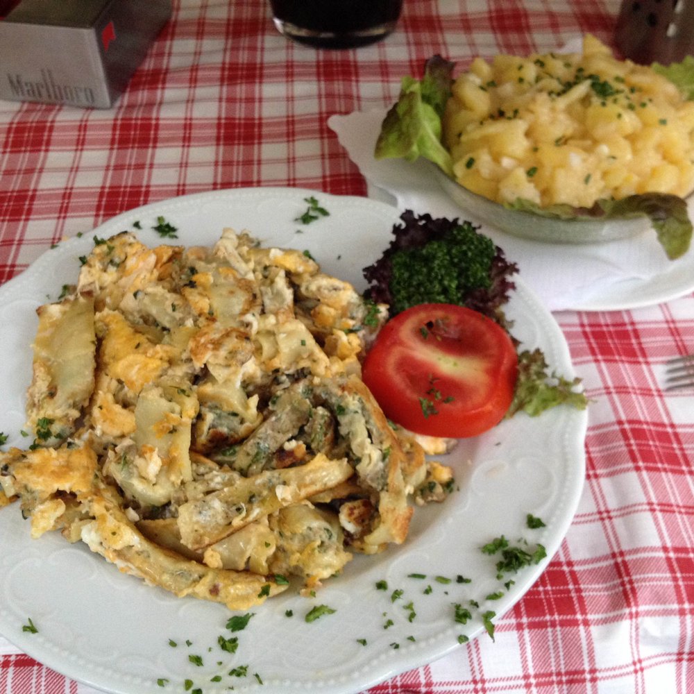 Stäffele - Pan-friend maultaschen with egg, and a side of potato salad in the background. - Swabian Near Me - Stuttgart, BW