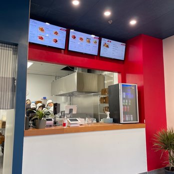 Chicko Chicken - a restaurant counter with menus on the wall - Korean Near Me - Vancouver, British Columbia Chicko Chicken - a restaurant counter with menus on the wall - Korean Near Me - Vancouver, British Columbia