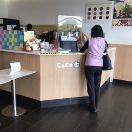 a woman standing at the counter a woman standing at the counter